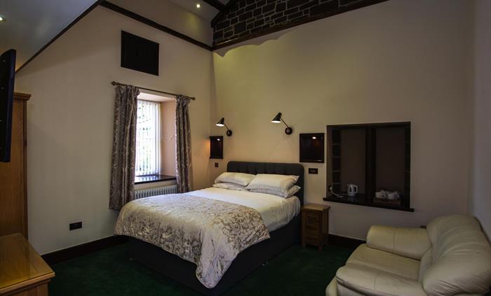 Ground Floor Bedroom. AB13 - Family Room at Craig y Nos Castle.